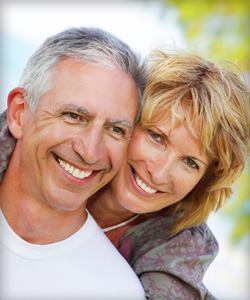 Arlington TX couple had their missing teeth problem fixed with partial dentures and implant dentures in Arlington TX.