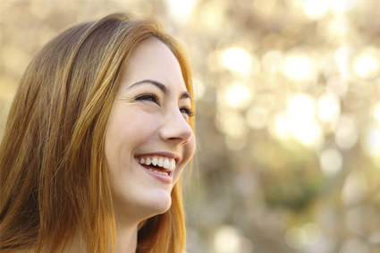 Girl smiles after going to her cosmetic dentist in Arlington TX.